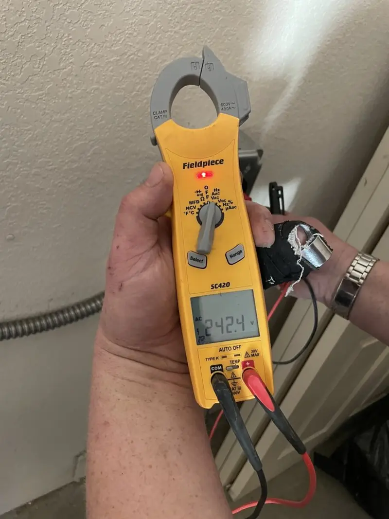 Voltage testing with clamp meter during Recessed Lighting Installation in Smith